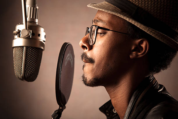 African-American recording artist recording an album in the studio